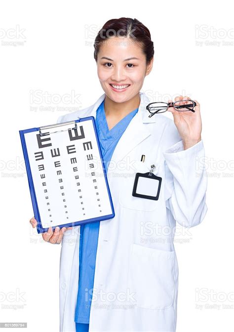 Female Optometrist Holding An Eye Chart Stock Photo Download Image