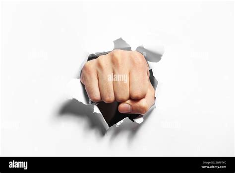 Fist Punching Through Paper Hi Res Stock Photography And Images Alamy