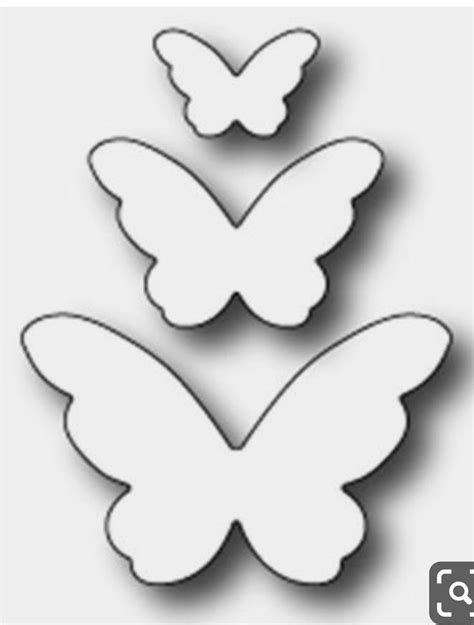 Three White Butterflies Are Shown In The Shape Of A Butterfly With One