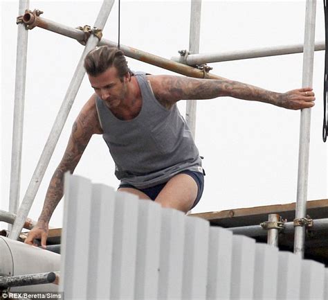 David Beckham Leaves Little To The Imagination As He Swings Through The