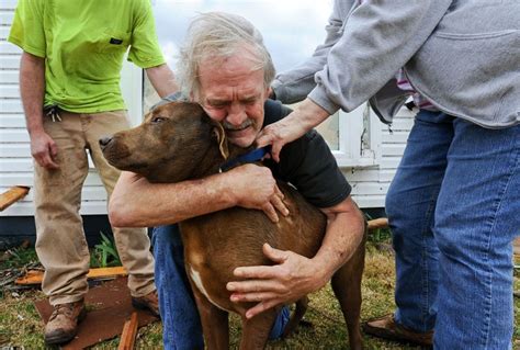 Man Hugs His Dog After Being Rescued From An Disastrous Tornado I