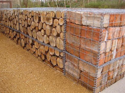 These wire meshes are filled with rock and masonry to form large blocks. brick gabion walls - Pesquisa Google | Gabion wall, Gabion fence, Garden retaining wall
