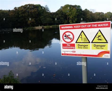 No Swimming Sign In Front Of A Lake Stock Photo Alamy