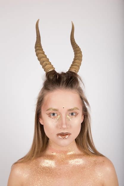 Premium Photo Woman With Horns On A White Background