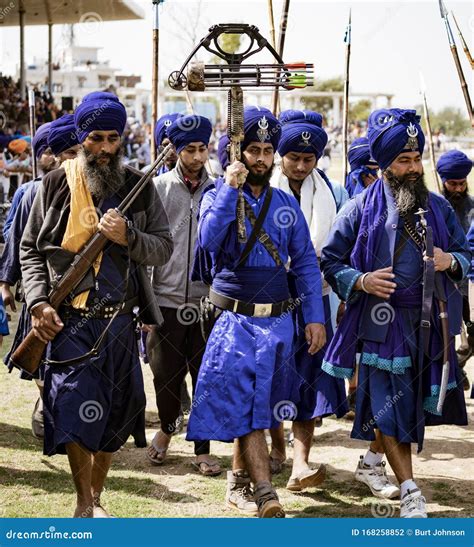 Sihks Wearing Blue Turbans And Cloaks March Toward A Festival Editorial