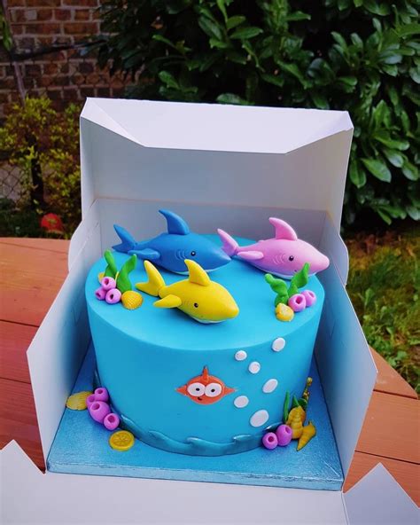 Make waves with baby shark birthday party decor. Baby shark birthday cake | Shark birthday cakes, Shark ...