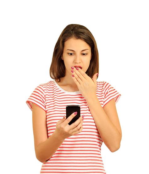 Portrait If A Shocked Young Girl Looking At Mobile Phone Emotional
