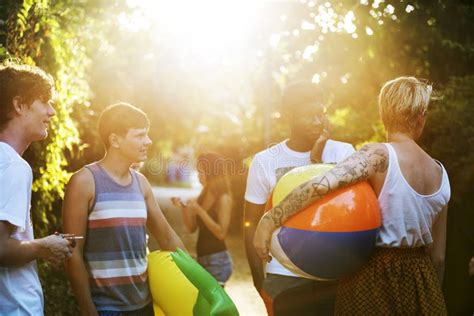A Diverse Group Of Friends Enjoying Summer Time Together Stock Photo