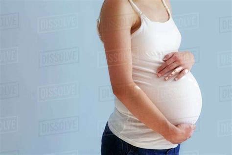 Pregnant Woman Holding Her Belly Stock Photo Dissolve