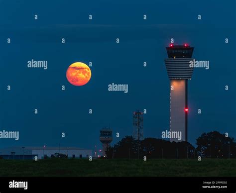 The Super Blue Moon Rising Beside The Old And New Dublin Airport Air