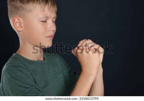 Boy Clasped Hands Praying On Black Stock Photo 2258613799 Shutterstock