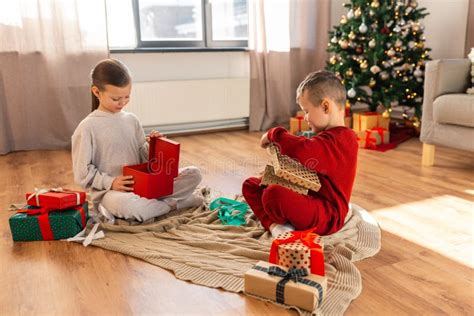 Happy Children Opening Christmas Ts At Home Stock Image Image Of