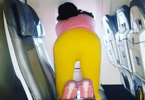 bizarre moment woman starts performing yoga routine on united airlines flight