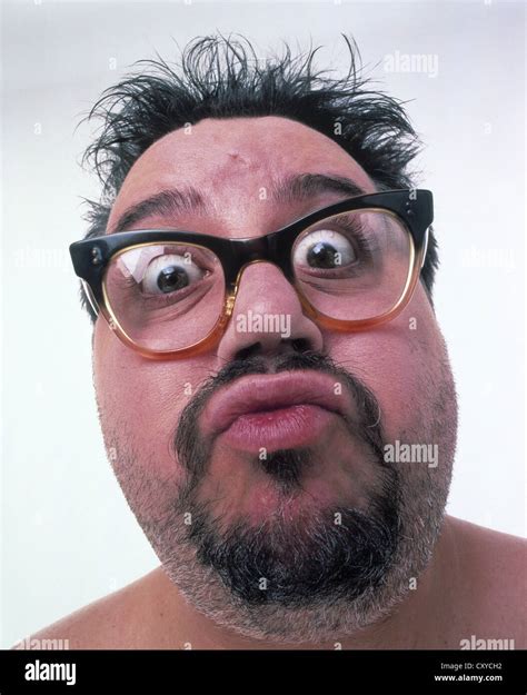 Middle Aged Fat Man Wearing Glasses Unshaved With A Surprised Face