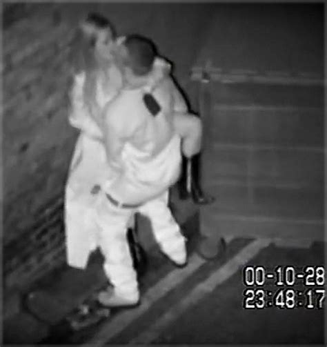 Unsuspecting Couples Caught Romping On CCTV In Dingy Passage Behind