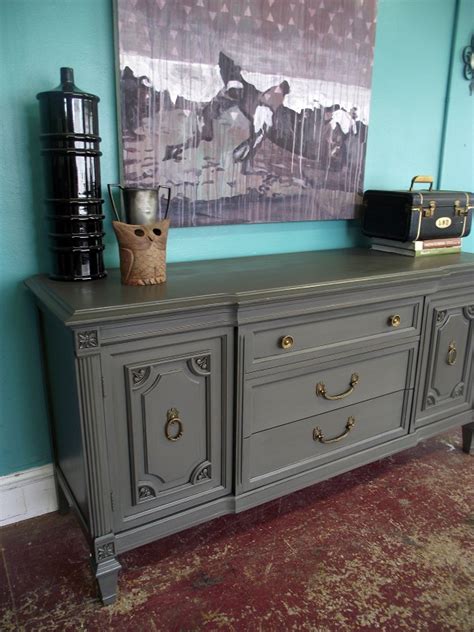 The light grey wash of its exterior is beautifully contrasted by a dark grey interior the inside is split into two sections each with a single shelf for storage. Vintage Ground: Vintage Gray Buffet / Sideboard