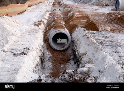 Laying Sewer Concrete Drainage Pipe Between Large Residential Areas
