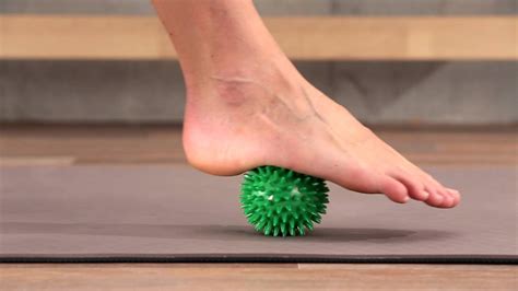 Foot Rehab Stimulating The Foot Muscles With The Spiky Massage Ball