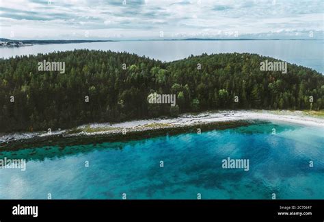 Aerial View Ocean And Uninhabited Island With Coniferous Forest Drone