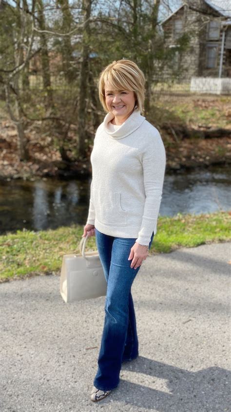Sweater weather. Winter white and jeans for with Snakeprint boots ...