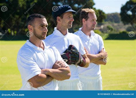 Confident Cricket Players Standing At Grassy Field Stock Image Image