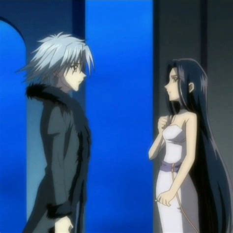 Two Anime Characters Standing Next To Each Other In Front Of A Blue