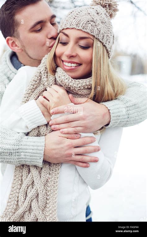 Young Man Embracing And Kissing His Girlfriend Stock Photo Alamy
