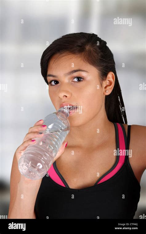 Teen Girl Drinking Water At The Gym Stock Photo Alamy
