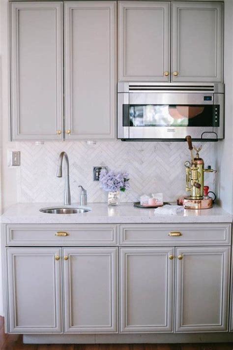 Light grey matte lacquer kitchen cabinets were combined. Color combination--Light gray cabinets, white counter tops ...