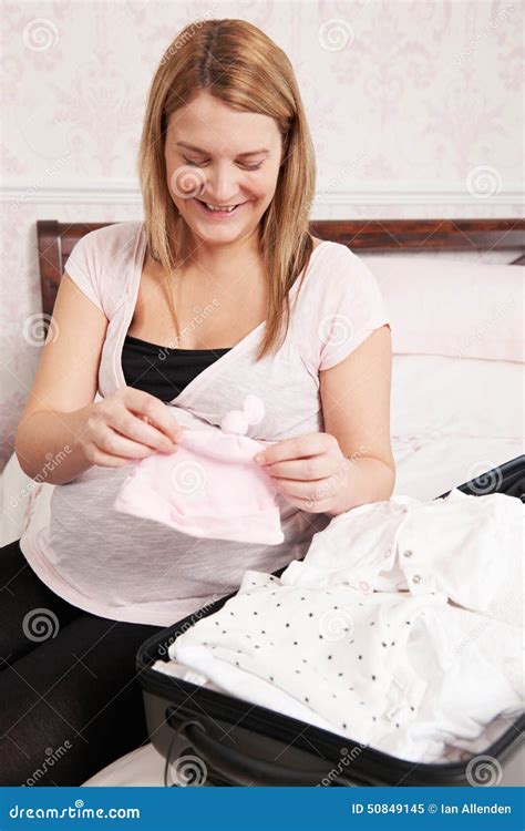 pregnant woman packing suitcase for trip to hospital stock image image of suitcase packing