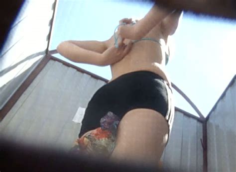 white slender chick in the beach cabin filmed on hidden cam video
