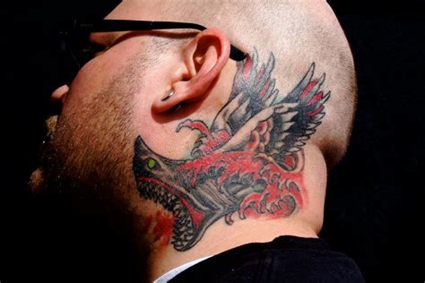 Maybe you would like to learn more about one of these? Old School Head Neck Wings Shark Tattoo by Omaha Tattoo