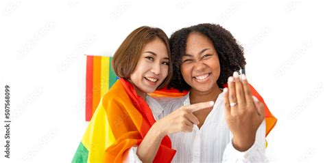 Couple Of Same Sex Marriage From Difference Races Showing Their Wedding Ring With Lgbtq Rainbow