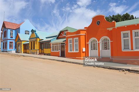 Colorful Row Orangeblueyellow Houses In Luderitz Namibia Stock Photo