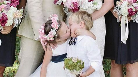 Adorable Flower Girl Steals Kiss From Ring Bearer