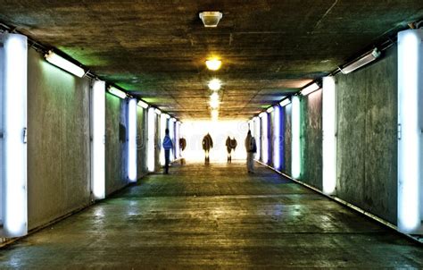 Commuters Walking Through Underground Tunnel Stock Photo Image Of