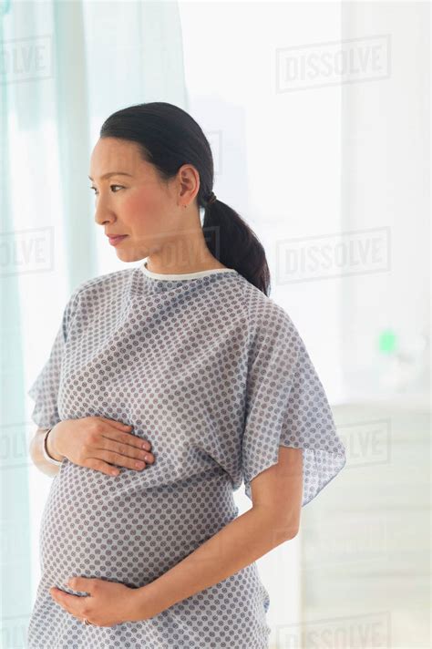 Pregnant Japanese Woman In Hospital Gown Stock Photo Dissolve