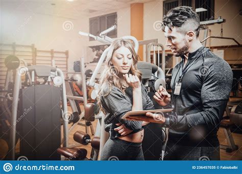 Man And Woman Looking At Each Other In Gym Athletic Man Holding