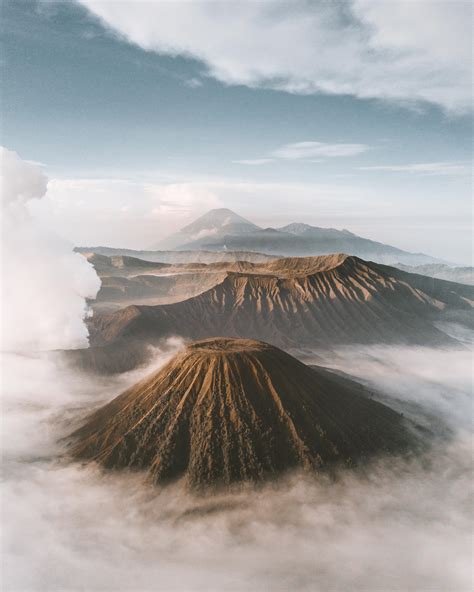 Sunrise Above The Clouds In The Tengger Massif Of Bromo