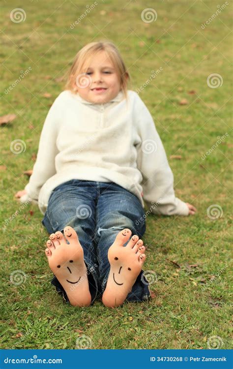 Girl With Smileys On Toes And Soles Stock Photo Image Of Girl Grass