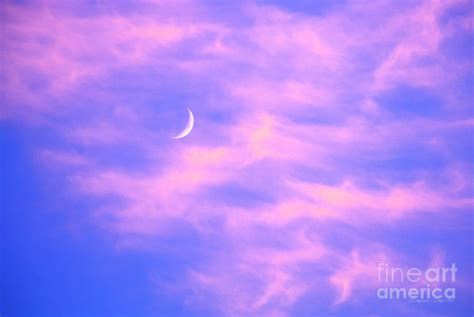 Crescent Moon Behind Cirrus Cloud In The Evening