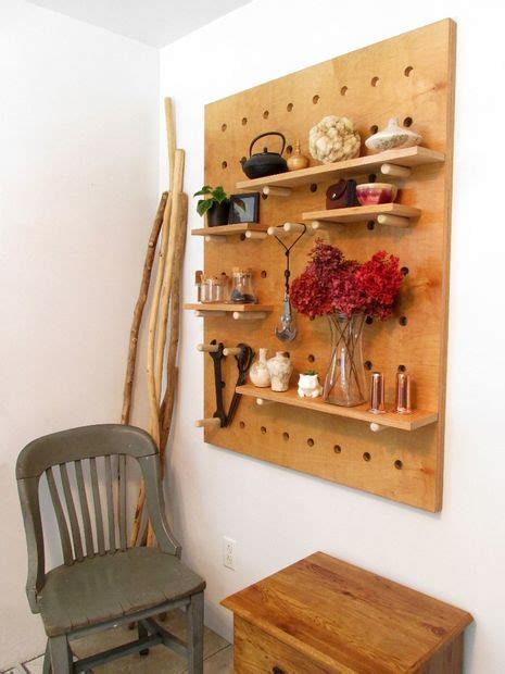 The easiest way to install adjustable shelves are with small, metal shelf pegs like this. DIY Big Peg Board Shelving System | Adjustable shelving, French cleat and Hanger