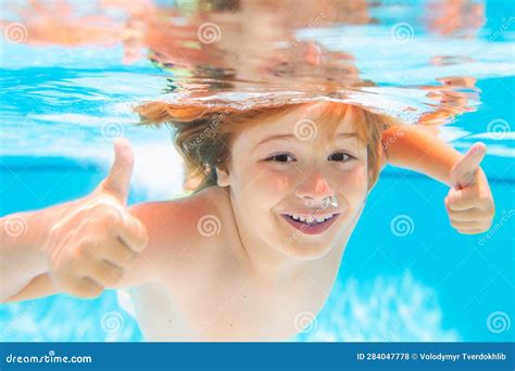 Child Face Underwater With Thumbs Up Young Boy Swim And Dive