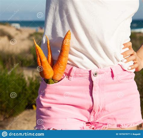 Fresh Carrots In The Girl`s Pocket Healthy Food For A Fit Shape Stock Image Image Of Vegan