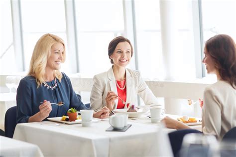 Women Eating Dessert And Talking At Restaurant Stock Image Image Of Coffee Discussing