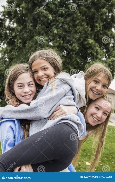Group Of Teenage Girls Playing And Smiling Together Outdoors Stock Image Image Of Dentist