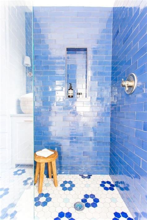 Bathroom With Bright Blue Tiles And Hex Ones With Blue Floral Accents