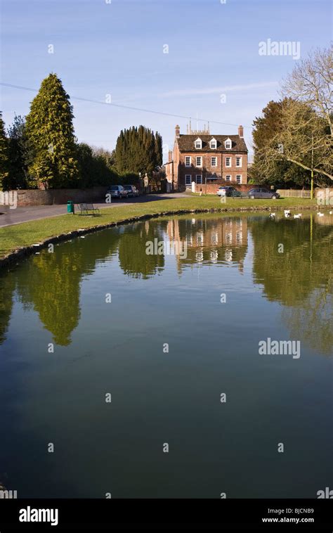 Village Pond And Reflections In Urchfont Wiltshire England Uk Eu Stock