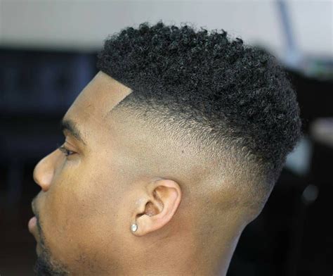 The top hairstyles for black men usually have a low or high fade haircut with short hair styled someway on top. Pin on "BLACK MEN HAIRCUTS"