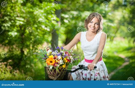 Beautiful Girl Wearing A Nice White Dress Having Fun In Park With Bicycle Healthy Outdoor